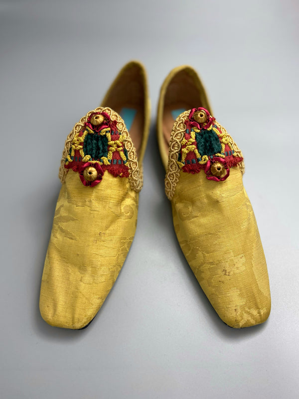 Golden yellow antique silk shoes with red and green silk chenille passementerie braid embellishment. Bohemian styles by Pavilion Parade