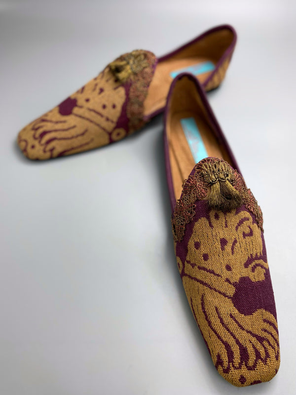 Burgundy red and old gold linen silk brocade slipper shoes. Woven heraldic leopard motifs. Sustainably created from antique textiles from the Pavilion Parade studio.