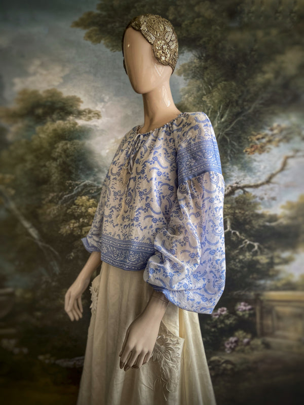 China blue and white cotton muslin block printed blouse with long full sleeves and adjustable drawstring neckline. Bohemian styles sustainably created from antique and vintage textiles by the Pavilion Parade studio. 