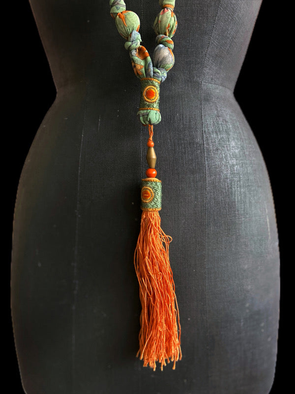 1920s style long silk sautoir necklace with antique tassel embellishment. Bohemian style from vintage textiles by Pavilion Parade. 