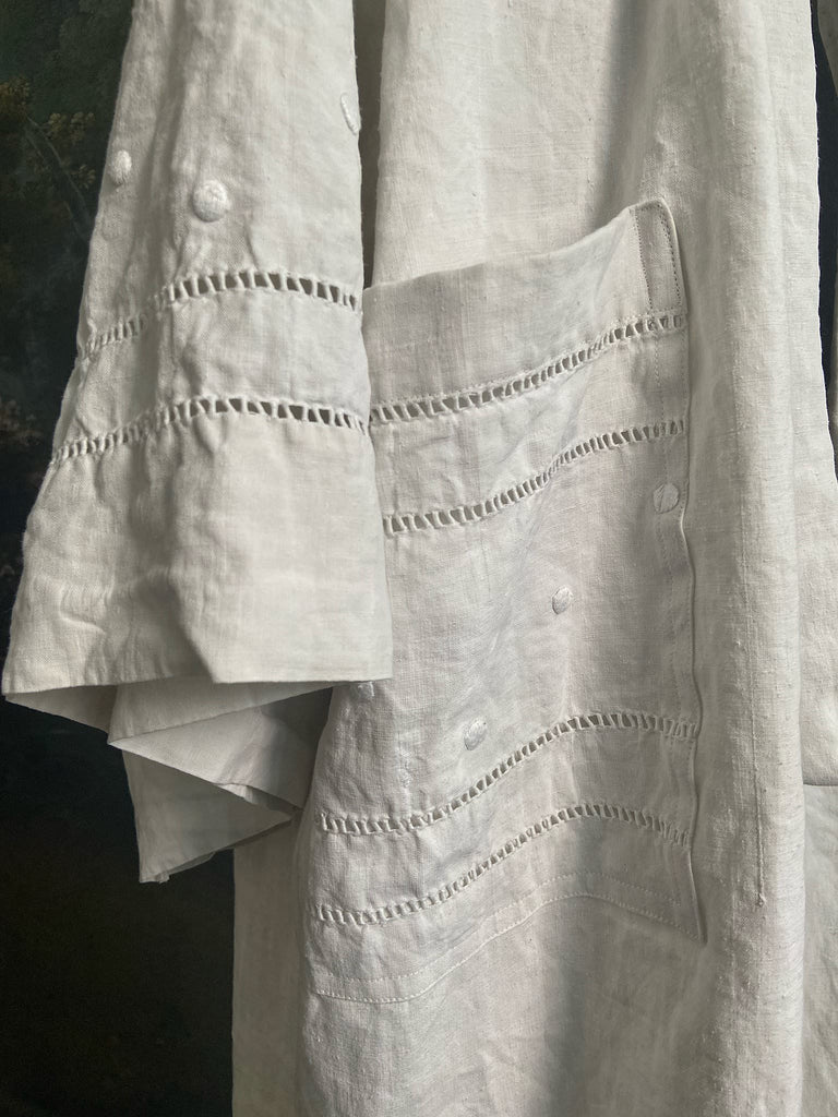 Full length kimono inspired robe with large patch pockets and wide sleeves. Created from an antique heavy French linen trousseau sheet with heirloom embroidery and drawn thread work. All French seamed with hand finished hems and collar. Bohemian styles sustainably created from antique and vintage textiles by the Pavilion Parade studio.