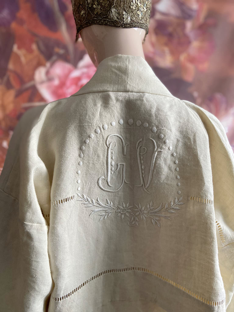 Full length kimono inspired robe with large patch pockets and wide sleeves. Created from an antique heavy French linen trousseau sheet with heirloom embroidery and drawn thread work. All French seamed with hand finished hems and collar. Bohemian styles sustainably created from antique and vintage textiles by the Pavilion Parade studio.