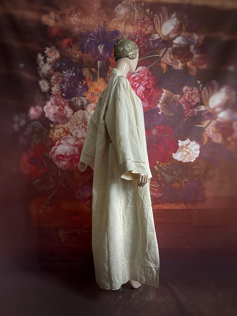 Full length kimono inspired robe with large patch pockets and wide sleeves. Created from an antique heavy French linen trousseau sheet with heirloom embroidery and drawn thread work. All French seamed with hand finished hems and collar. Bohemian styles sustainably created from antique and vintage textiles by the Pavilion Parade studio.