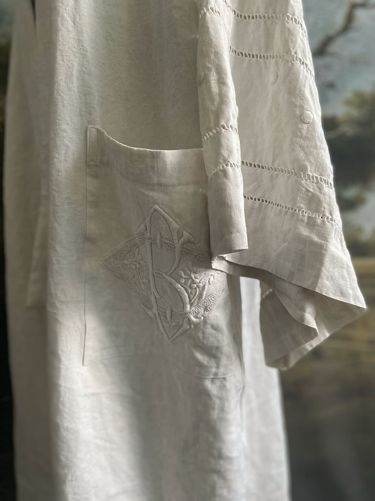 Full length kimono inspired robe with large patch pockets and wide sleeves. Created from an antique heavy French linen trousseau sheet with heirloom embroidery and drawn thread work. All French seamed with hand finished hems and collar. Bohemian styles sustainably created from antique and vintage textiles by the Pavilion Parade studio.