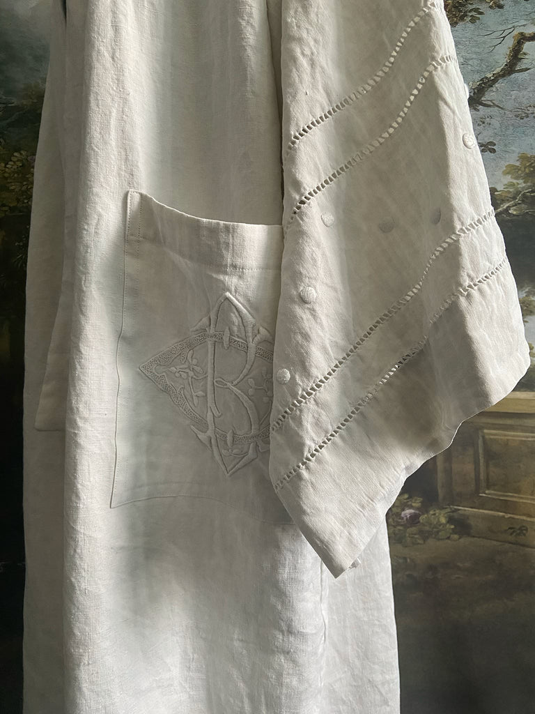 Full length kimono inspired robe with large patch pockets and wide sleeves. Created from an antique heavy French linen trousseau sheet with heirloom embroidery and drawn thread work. All French seamed with hand finished hems and collar. Bohemian styles sustainably created from antique and vintage textiles by the Pavilion Parade studio.