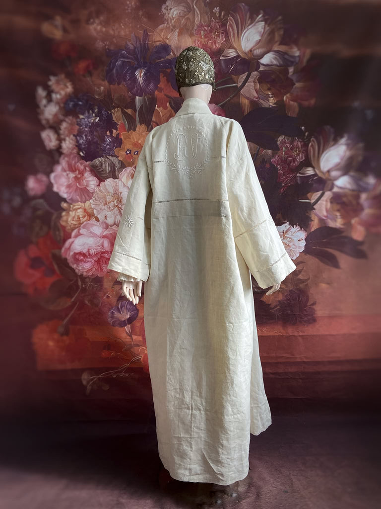 Full length kimono inspired robe with large patch pockets and wide sleeves. Created from an antique heavy French linen trousseau sheet with heirloom embroidery and drawn thread work. All French seamed with hand finished hems and collar. Bohemian styles sustainably created from antique and vintage textiles by the Pavilion Parade studio.
