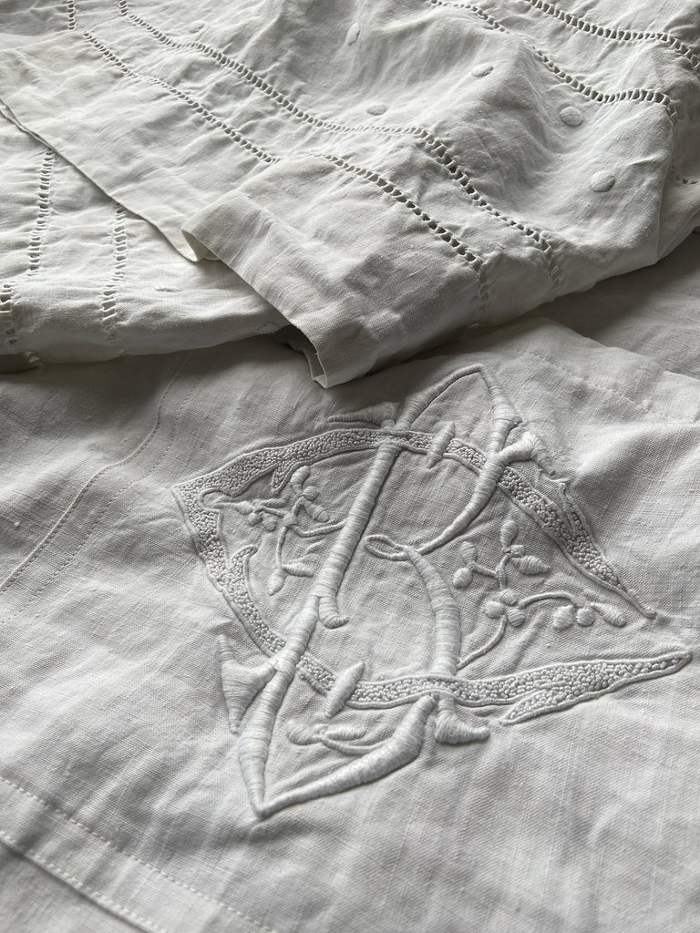 Full length kimono inspired robe with large patch pockets and wide sleeves. Created from an antique heavy French linen trousseau sheet with heirloom embroidery and drawn thread work. All French seamed with hand finished hems and collar. Bohemian styles sustainably created from antique and vintage textiles by the Pavilion Parade studio.