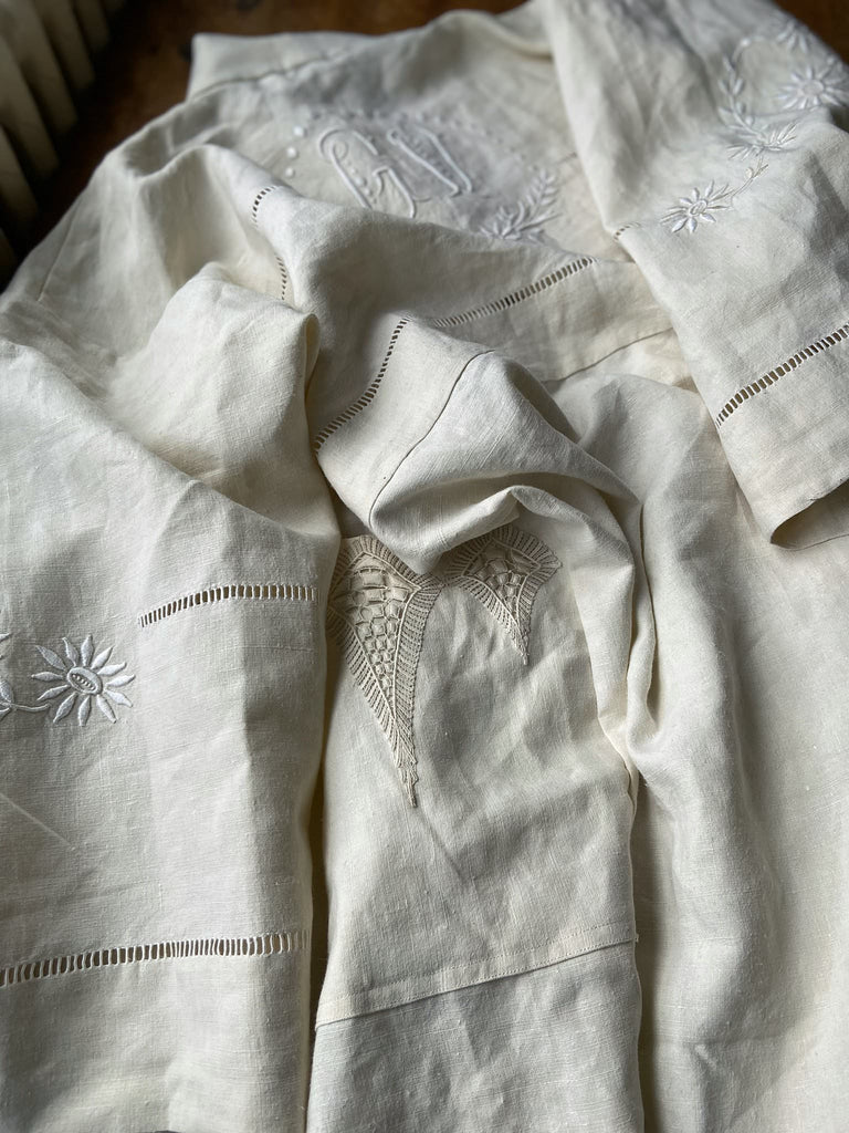 Full length kimono inspired robe with large patch pockets and wide sleeves. Created from an antique heavy French linen trousseau sheet with heirloom embroidery and drawn thread work. All French seamed with hand finished hems and collar. Bohemian styles sustainably created from antique and vintage textiles by the Pavilion Parade studio.