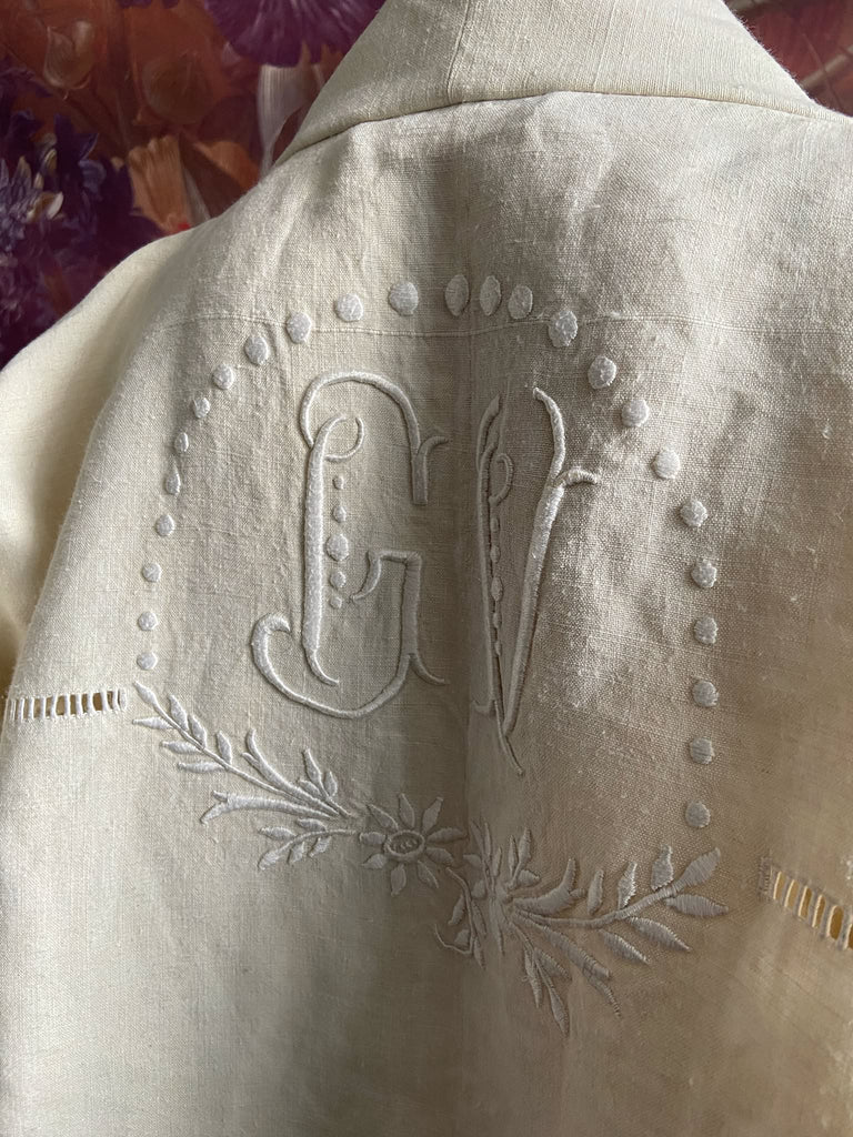 Full length kimono inspired robe with large patch pockets and wide sleeves. Created from an antique heavy French linen trousseau sheet with heirloom embroidery and drawn thread work. All French seamed with hand finished hems and collar. Bohemian styles sustainably created from antique and vintage textiles by the Pavilion Parade studio.