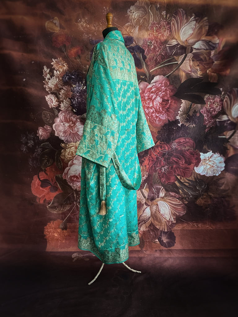 Aqua green and bronze lightweight luxury silk wrapper robe with wide sleeves, large patch pockets and tassel sash. Bohemian style created from antique and vintage textiles by the Pavilion Parade studio.