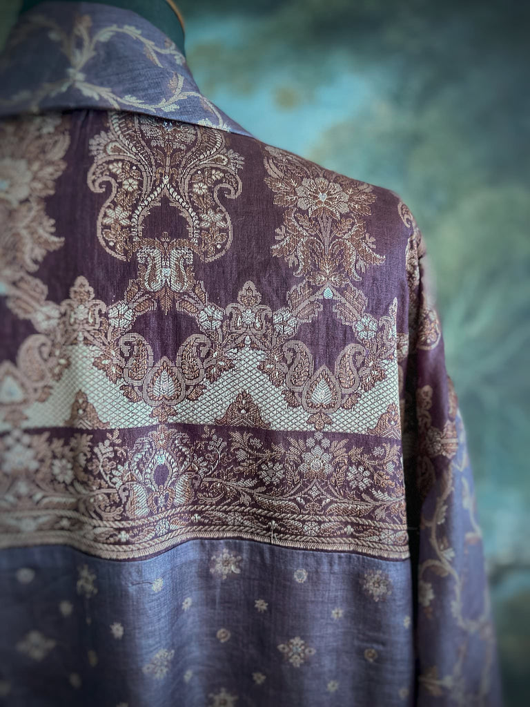 Dark lavender, aubergine, and silver-gilt silk robe with wide sleeves, tassel sash, and deep pockets. Unique bohemian styles sustainably created from vintage textiles by the Pavilion Parade studio.