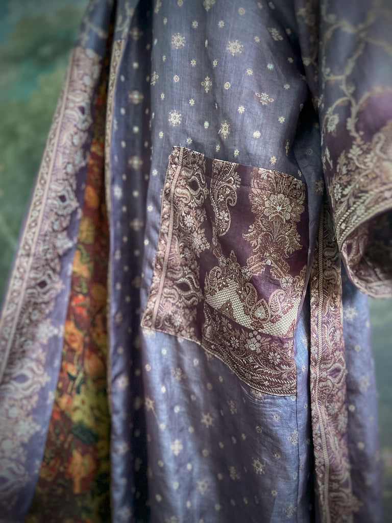 Dark lavender, aubergine, and silver-gilt silk robe with wide sleeves, tassel sash, and deep pockets. Unique bohemian styles sustainably created from vintage textiles by the Pavilion Parade studio.