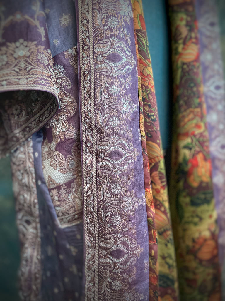 Dark lavender, aubergine, and silver-gilt silk robe with wide sleeves, tassel sash, and deep pockets. Unique bohemian styles sustainably created from vintage textiles by the Pavilion Parade studio.