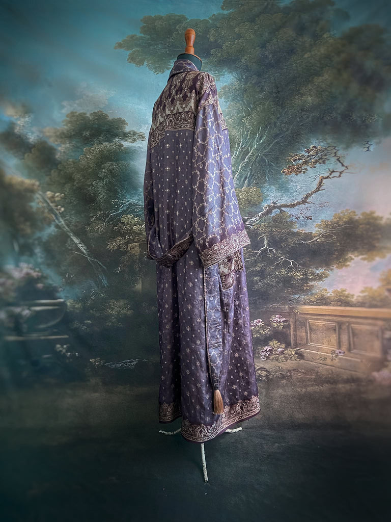 Dark lavender, aubergine, and silver-gilt silk robe with wide sleeves, tassel sash, and deep pockets. Unique bohemian styles sustainably created from vintage textiles by the Pavilion Parade studio.