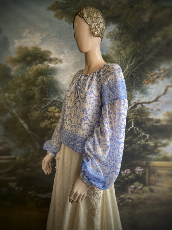 China blue and white cotton muslin block printed blouse with long full sleeves and adjustable drawstring neckline. Bohemian styles sustainably created from antique and vintage textiles by the Pavilion Parade studio. 