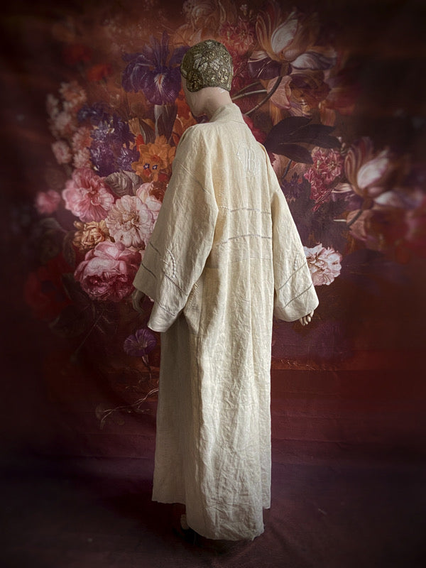 Full length kimono inspired robe with large patch pockets and wide sleeves. Created from an antique heavy French linen trousseau sheet with heirloom embroidery and drawn thread work. All French seamed with hand finished hems and collar. Bohemian styles sustainably created from antique and vintage textiles by the Pavilion Parade studio.