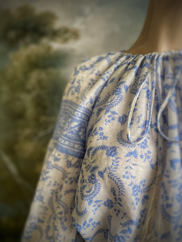 China blue and white cotton muslin block printed blouse with long full sleeves and adjustable drawstring neckline. Bohemian styles sustainably created from antique and vintage textiles by the Pavilion Parade studio. 