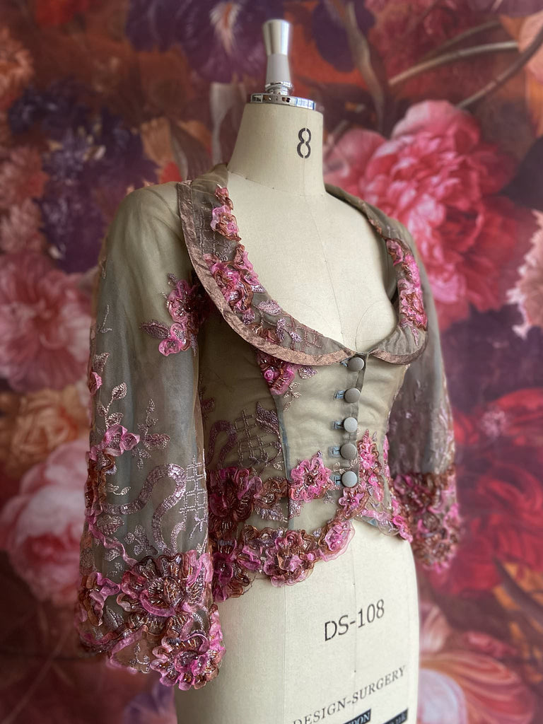 Ribbon embroidered and beaded silk and tulle bodice jacket with picture neckline and pagoda sleeves. French grey, rose pink and lavender. Flight of fancy from the Pavilion Parade studio. 