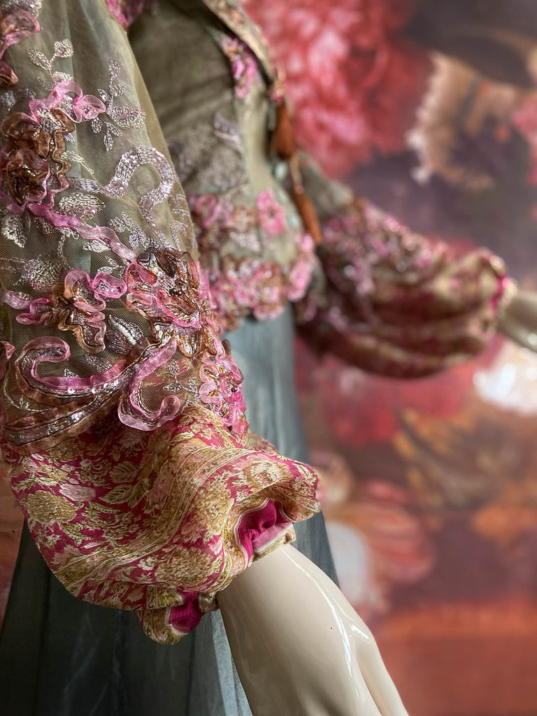 Ribbon embroidered and beaded silk and tulle bodice jacket with picture neckline and pagoda sleeves. French grey, rose pink and lavender. Flight of fancy from the Pavilion Parade studio. 