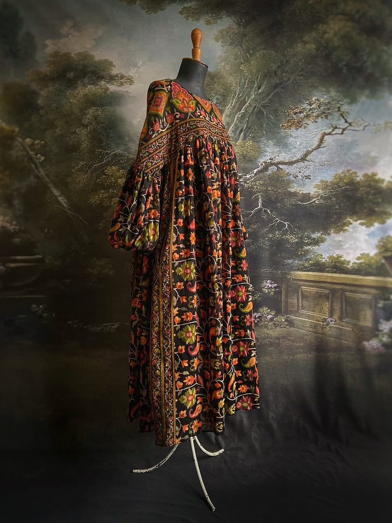 Vibrant Indian floral on black fine cotton muslin bohemian dress with full sleeves and pockets. Created from antique and vintage textiles by the Pavilion Parade studio