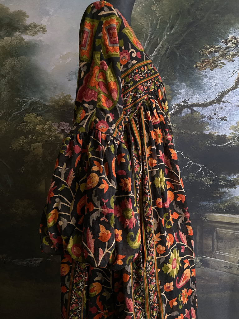 Vibrant Indian floral on black fine cotton muslin bohemian dress with full sleeves and pockets. Created from antique and vintage textiles by the Pavilion Parade studio