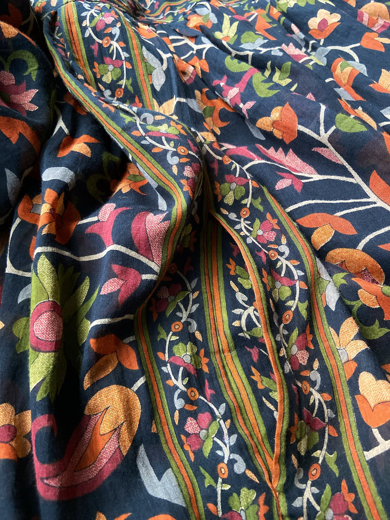 Vibrant Indian floral on black fine cotton muslin bohemian dress with full sleeves and pockets. Created from antique and vintage textiles by the Pavilion Parade studio
