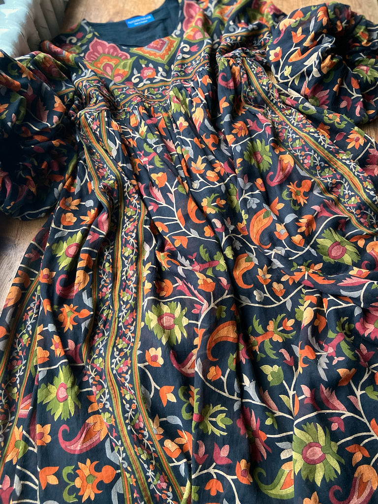 Vibrant Indian floral on black fine cotton muslin bohemian dress with full sleeves and pockets. Created from antique and vintage textiles by the Pavilion Parade studio