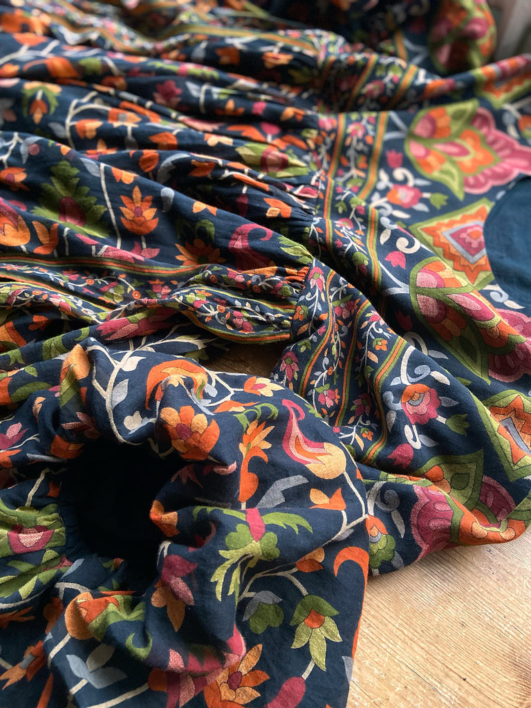 Vibrant Indian floral on black fine cotton muslin bohemian dress with full sleeves and pockets. Created from antique and vintage textiles by the Pavilion Parade studio
