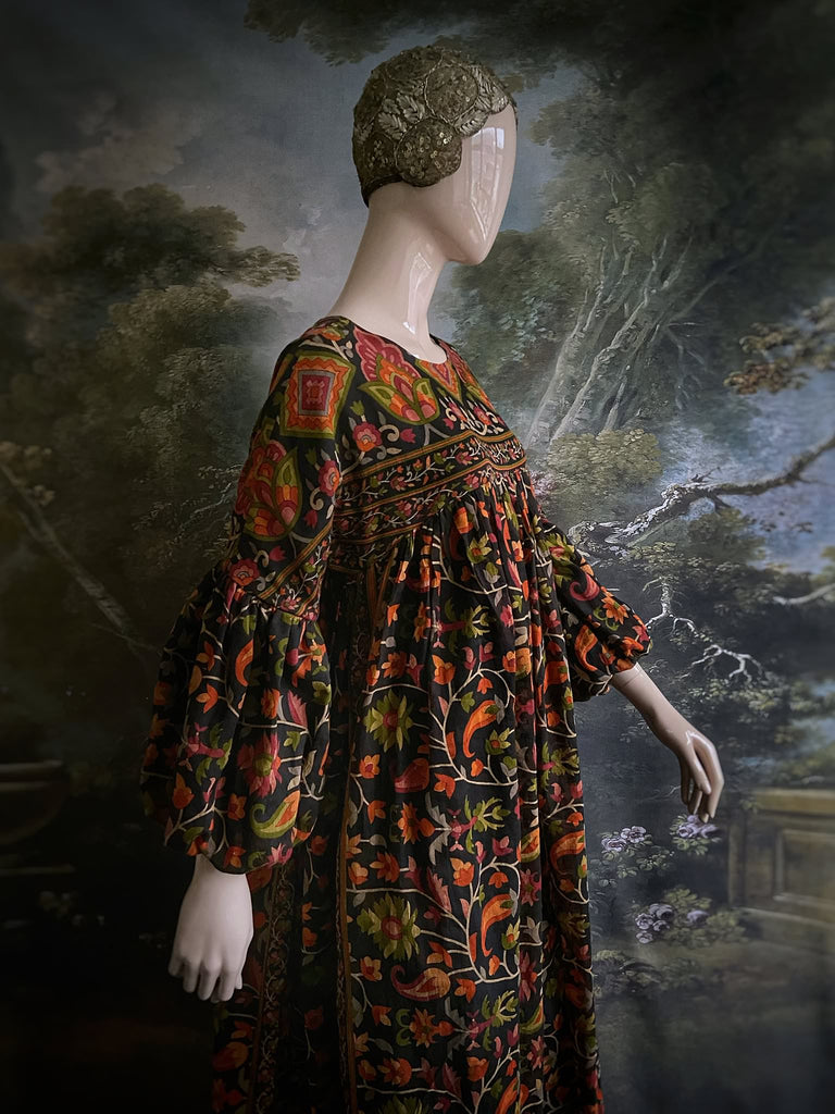 Vibrant Indian floral on black fine cotton muslin bohemian dress with full sleeves and pockets. Created from antique and vintage textiles by the Pavilion Parade studio