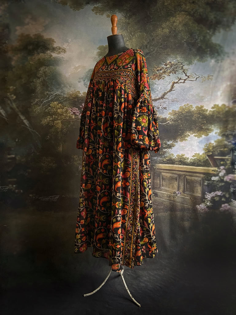 Vibrant Indian floral on black fine cotton muslin bohemian dress with full sleeves and pockets. Created from antique and vintage textiles by the Pavilion Parade studio