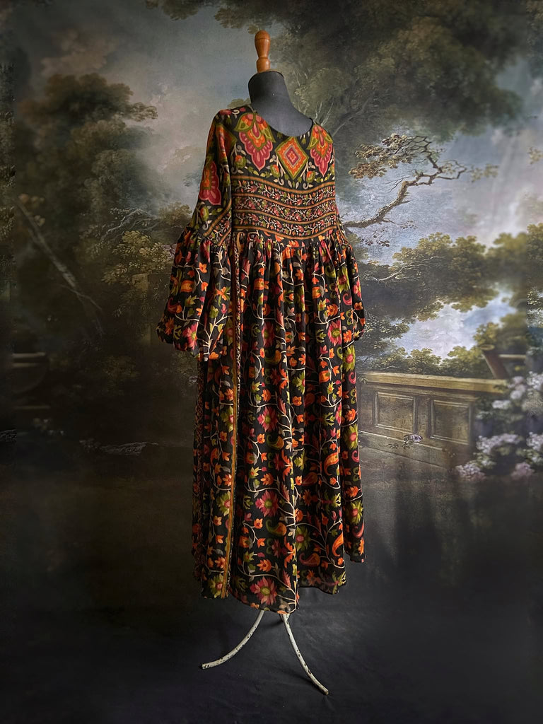 Vibrant Indian floral on black fine cotton muslin bohemian dress with full sleeves and pockets. Created from antique and vintage textiles by the Pavilion Parade studio