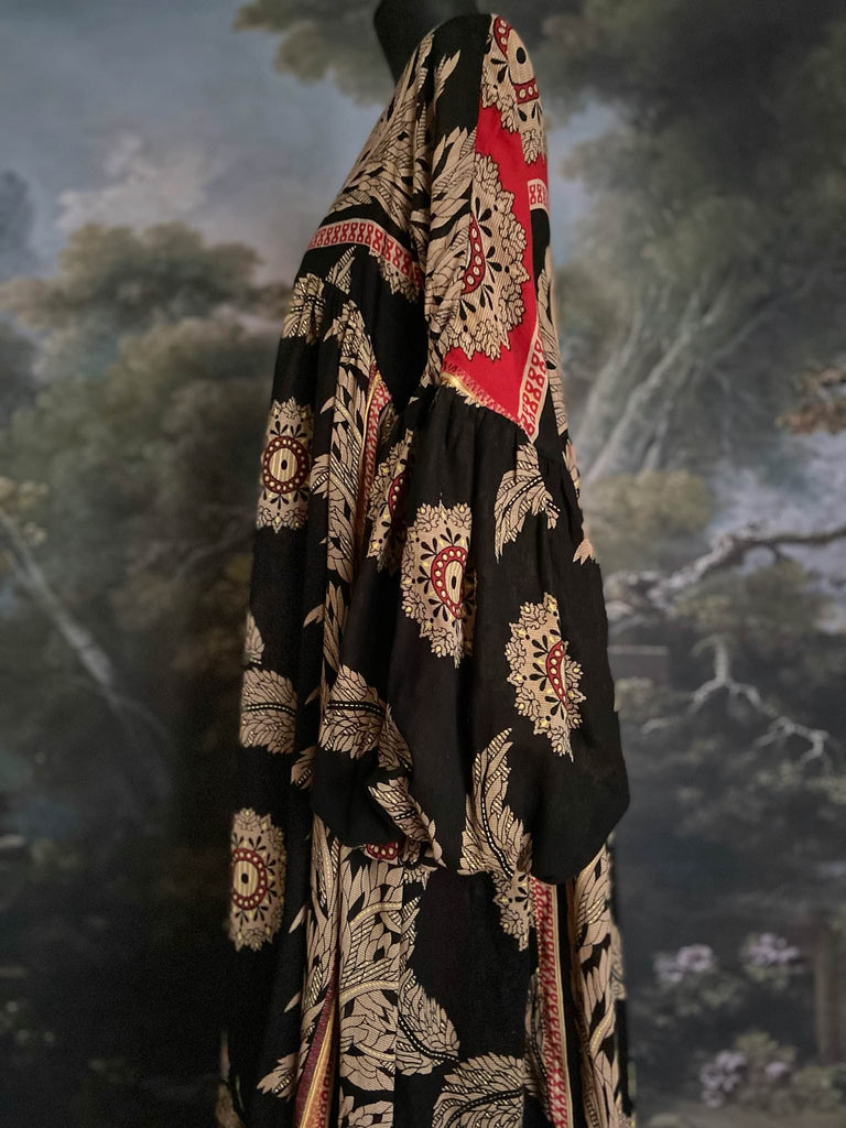 Black and scarlet full sleeve cotton maxi dress with an aesthetic movement inspiration. Bohemian style sustainably created from antique and vintage textiles by the Pavilion Parade studio.