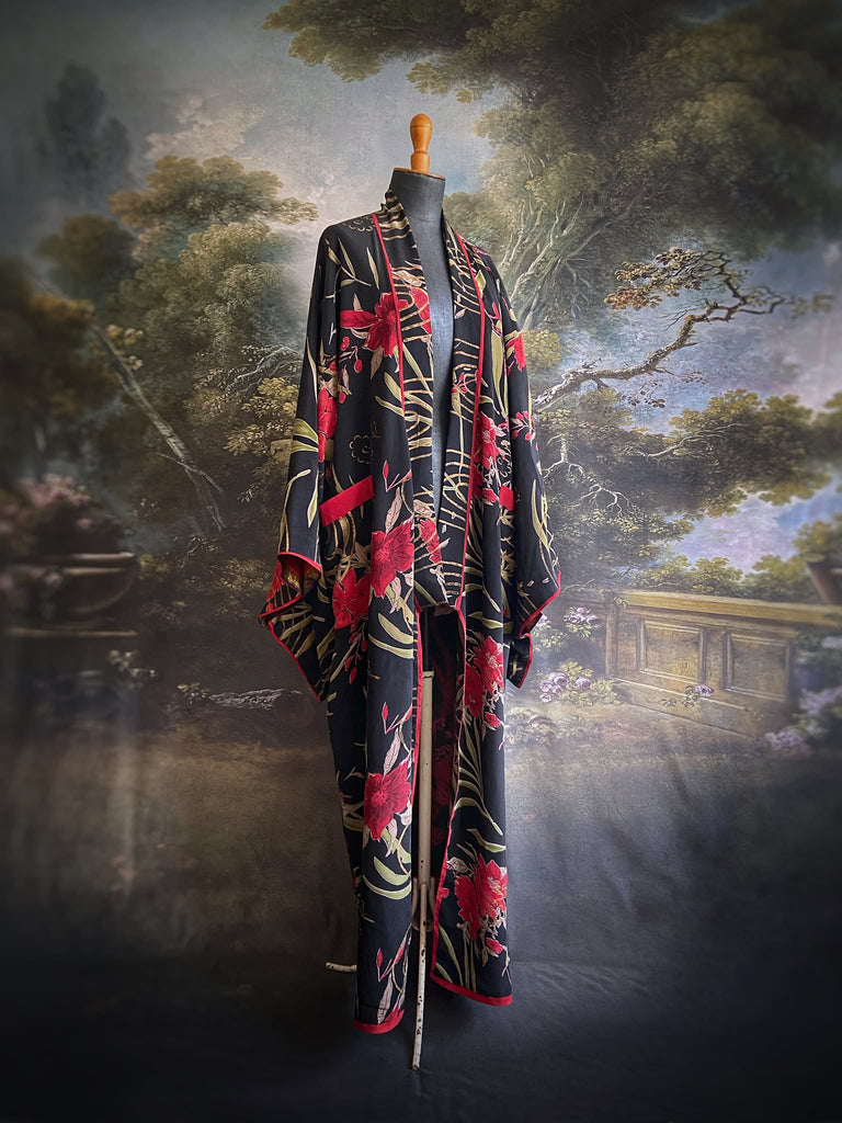 Full length 1920s inspired kimono robe with large patch pockets. Newly created from a scarlet and black 1930s style splashy floral vintage silk crepe. Fully lined in silk with French seams throughout. Bohemian styles sustainably created from antique and vintage textiles by the Pavilion Parade studio.