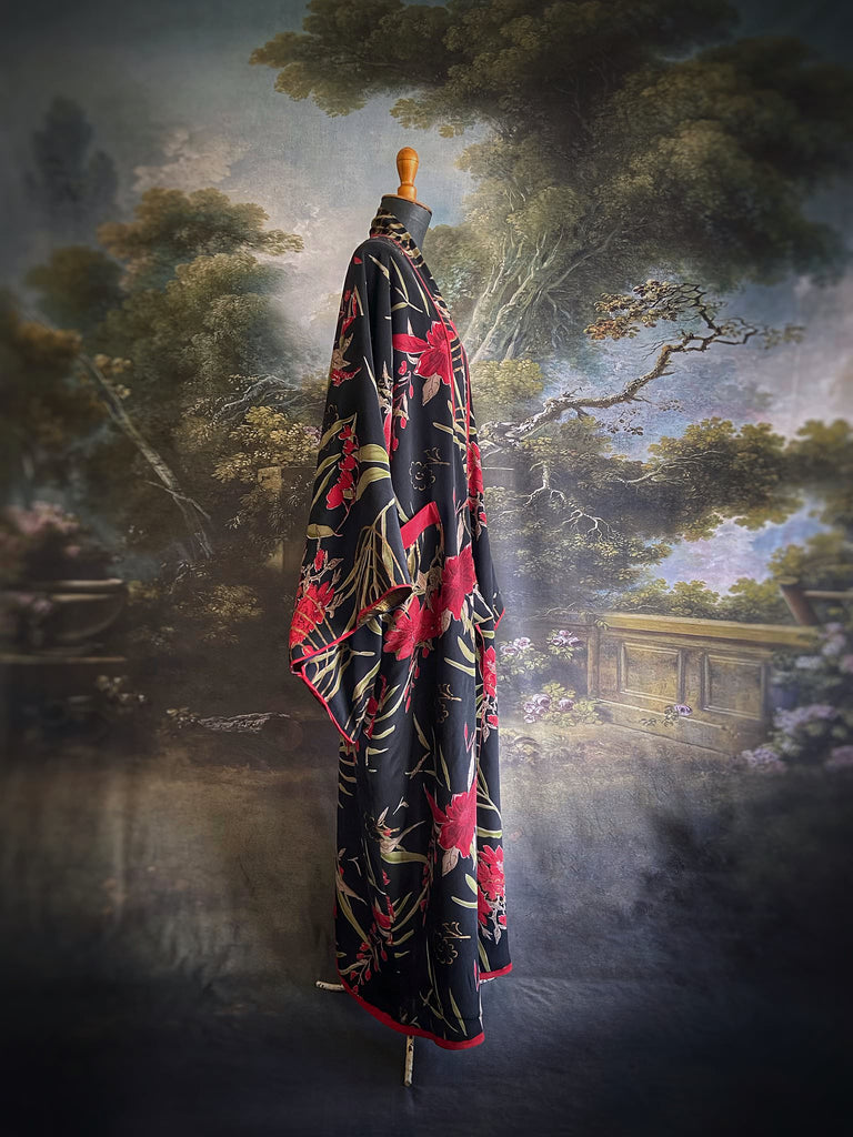 Full length 1920s inspired kimono robe with large patch pockets. Newly created from a scarlet and black 1930s style splashy floral vintage silk crepe. Fully lined in silk with French seams throughout. Bohemian styles sustainably created from antique and vintage textiles by the Pavilion Parade studio.