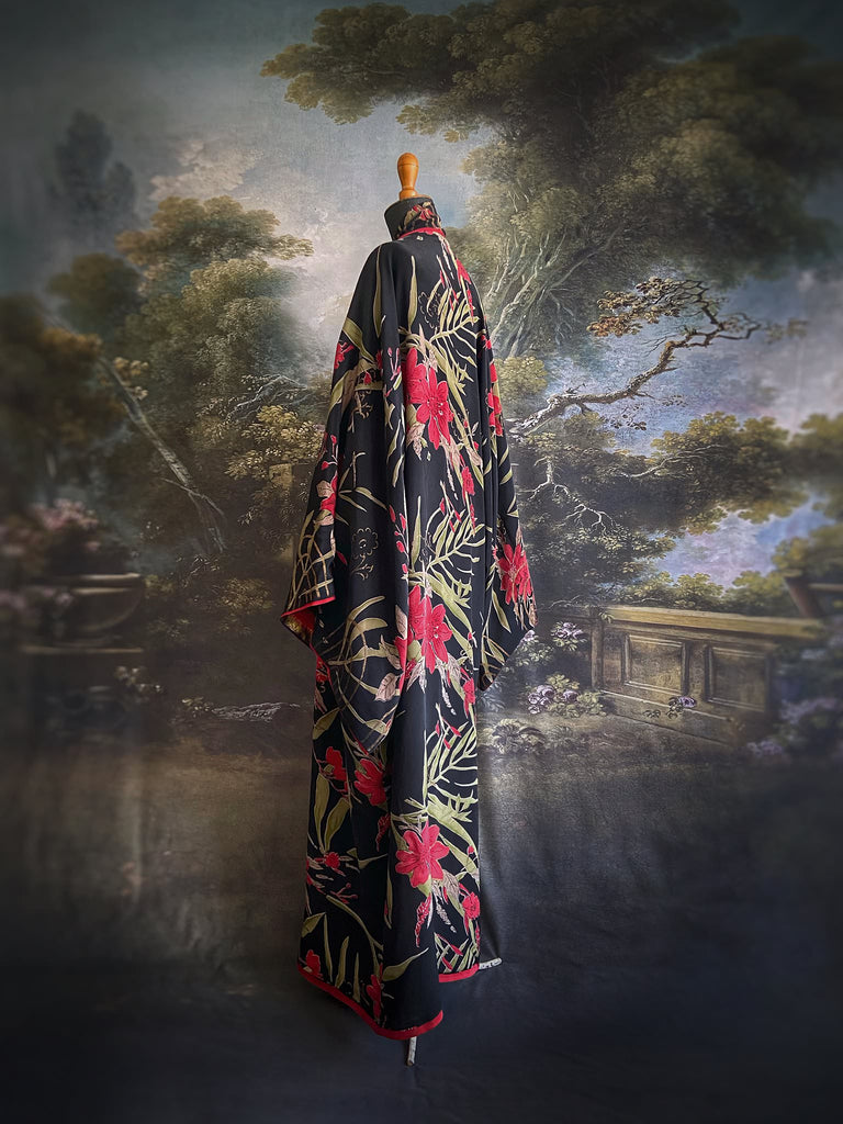 Full length 1920s inspired kimono robe with large patch pockets. Newly created from a scarlet and black 1930s style splashy floral vintage silk crepe. Fully lined in silk with French seams throughout. Bohemian styles sustainably created from antique and vintage textiles by the Pavilion Parade studio.