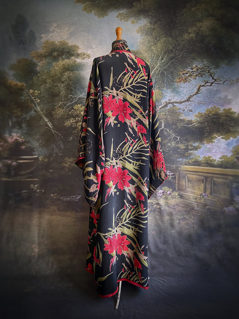 Full length 1920s inspired kimono robe with large patch pockets. Newly created from a scarlet and black 1930s style splashy floral vintage silk crepe. Fully lined in silk with French seams throughout. Bohemian styles sustainably created from antique and vintage textiles by the Pavilion Parade studio.
