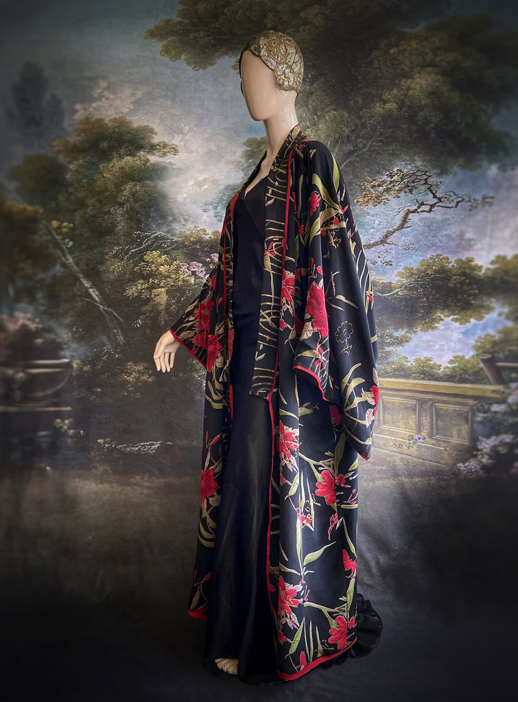 Full length 1920s inspired kimono robe with large patch pockets. Newly created from a scarlet and black 1930s style splashy floral vintage silk crepe. Fully lined in silk with French seams throughout. Bohemian styles sustainably created from antique and vintage textiles by the Pavilion Parade studio.