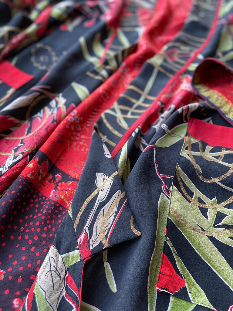 Full length 1920s inspired kimono robe with large patch pockets. Newly created from a scarlet and black 1930s style splashy floral vintage silk crepe. Fully lined in silk with French seams throughout. Bohemian styles sustainably created from antique and vintage textiles by the Pavilion Parade studio.