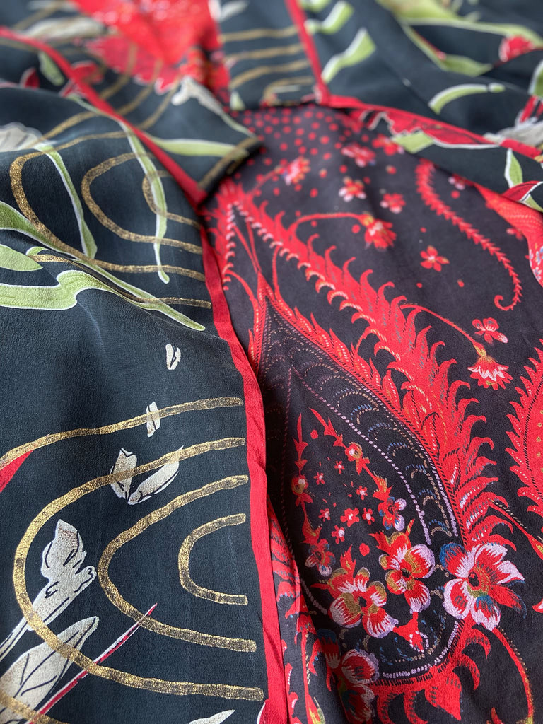 Full length 1920s inspired kimono robe with large patch pockets. Newly created from a scarlet and black 1930s style splashy floral vintage silk crepe. Fully lined in silk with French seams throughout. Bohemian styles sustainably created from antique and vintage textiles by the Pavilion Parade studio.