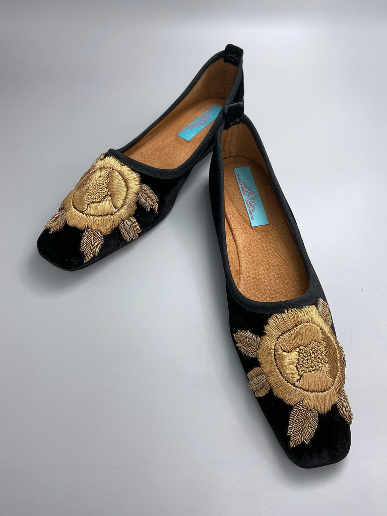Black silk velvet slipper shoes with extended squared toe shape. Embellished with gold work embroidered roses. Bohemian styles created from antique and vintage textiles by the Pavilion Parade studio. 