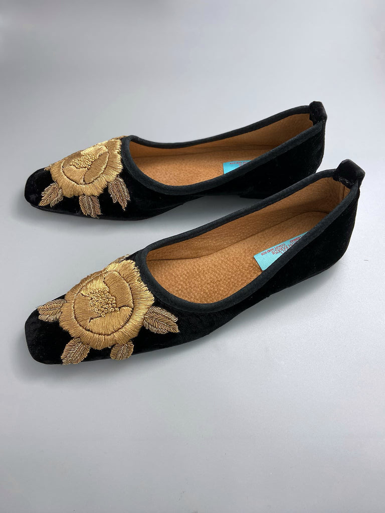 Black silk velvet slipper shoes with extended squared toe shape. Embellished with gold work embroidered roses. Bohemian styles created from antique and vintage textiles by the Pavilion Parade studio. 