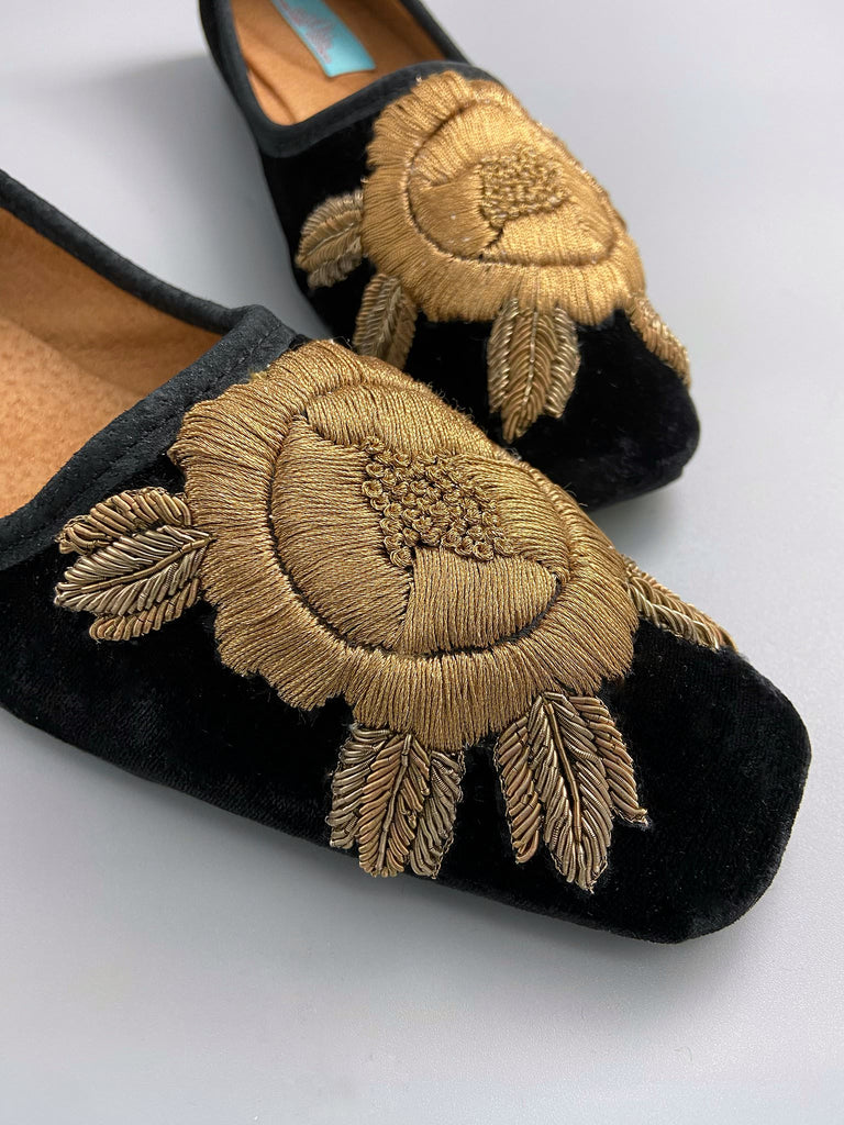 Black silk velvet slipper shoes with extended squared toe shape. Embellished with gold work embroidered roses. Bohemian styles created from antique and vintage textiles by the Pavilion Parade studio. 