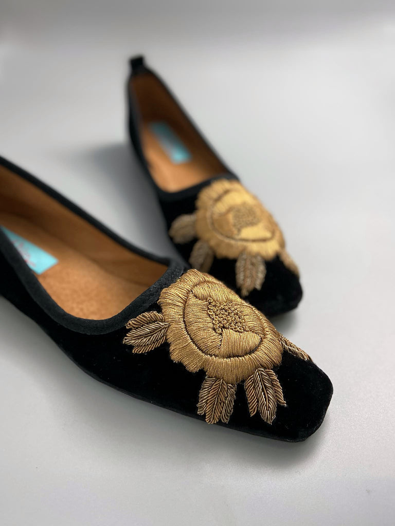 Black silk velvet slipper shoes with extended squared toe shape. Embellished with gold work embroidered roses. Bohemian styles created from antique and vintage textiles by the Pavilion Parade studio. 