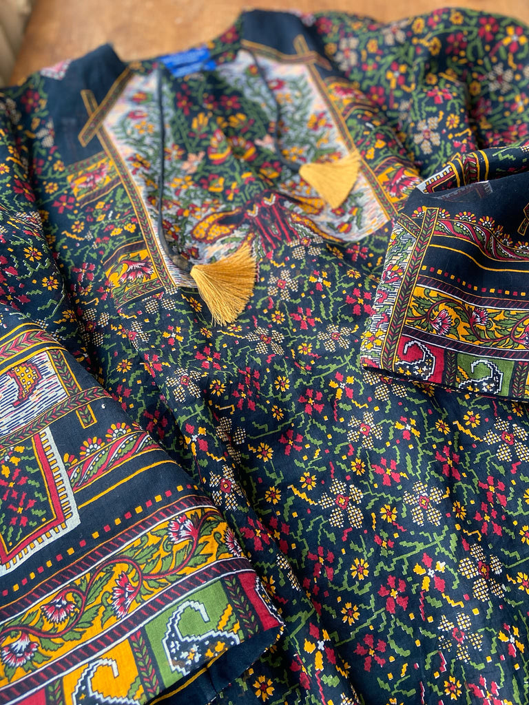 Black block printed floral cotton kaftan maxi dress with pockets and wide sleeves. Unique bohemian styles created from antique and vintage textiles by the Pavilion Parade Studio.