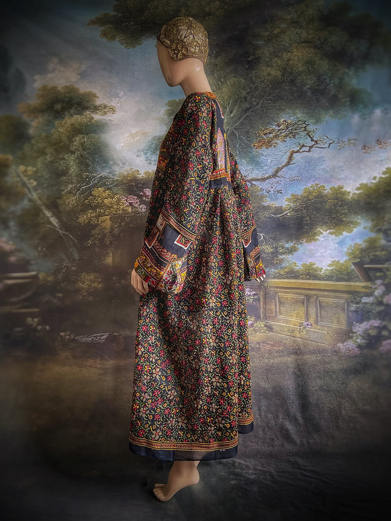 Black block printed floral cotton kaftan maxi dress with pockets and wide sleeves. Unique bohemian styles created from antique and vintage textiles by the Pavilion Parade Studio.