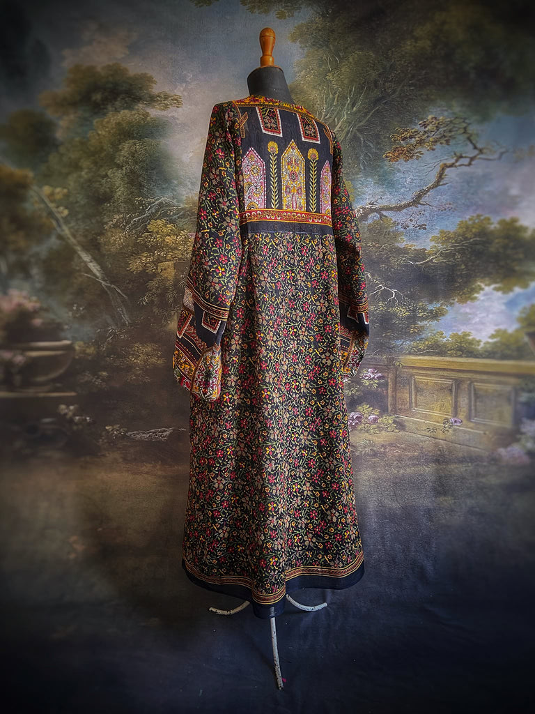 Black block printed floral cotton kaftan maxi dress with pockets and wide sleeves. Unique bohemian styles created from antique and vintage textiles by the Pavilion Parade Studio.