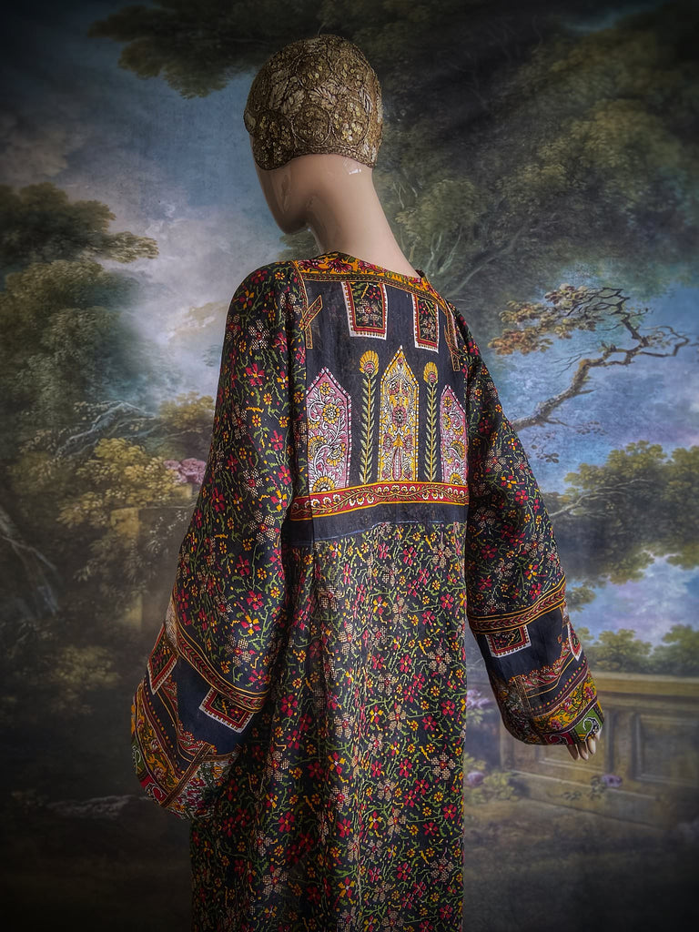 Black block printed floral cotton kaftan maxi dress with pockets and wide sleeves. Unique bohemian styles created from antique and vintage textiles by the Pavilion Parade Studio.