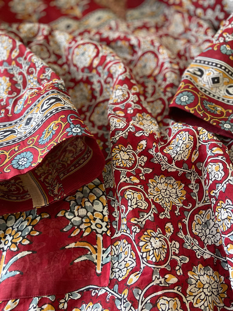 Deep burgundy red and ochre block printed kaftan inspired relaxed fit dress with wide sleeves and pockets. Bohemian style sustainably created from vintage textiles by the Pavilion Parade studio.. 