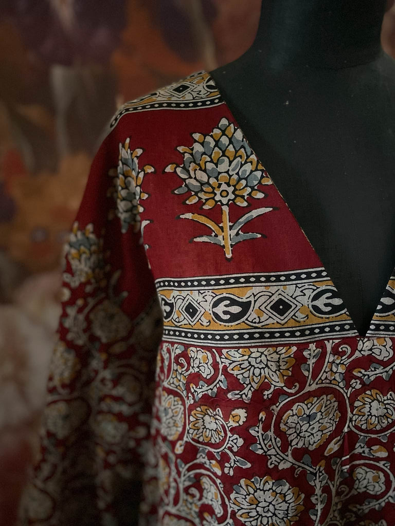 Deep burgundy red and ochre block printed kaftan inspired relaxed fit dress with wide sleeves and pockets. Bohemian style sustainably created from vintage textiles by the Pavilion Parade studio.. 