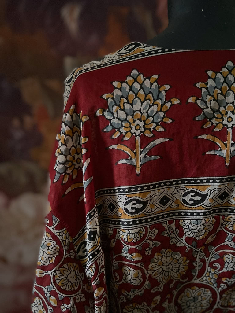 Deep burgundy red and ochre block printed kaftan inspired relaxed fit dress with wide sleeves and pockets. Bohemian style sustainably created from vintage textiles by the Pavilion Parade studio.. 